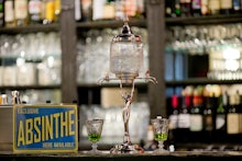 An absinthe fountain seen on the counter at the bar of the 'Casablanca' cinema in Nuremberg, Germany...
