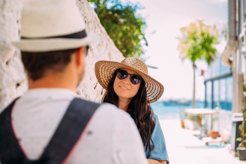 Lovers standing face to face, looking each other