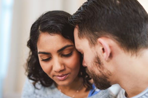 Cropped shot of a happy young couple sharing an intimate moment together during a relaxing day at ho...