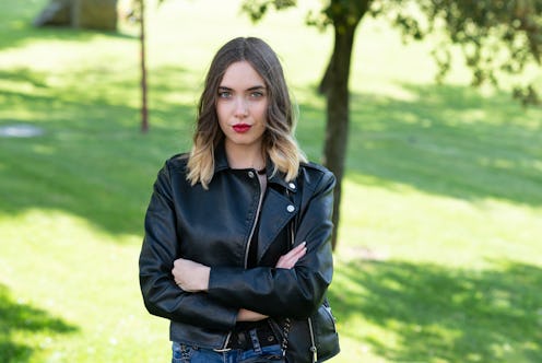 Portrait of confident young woman in city park