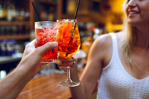 friends drinking at a bar