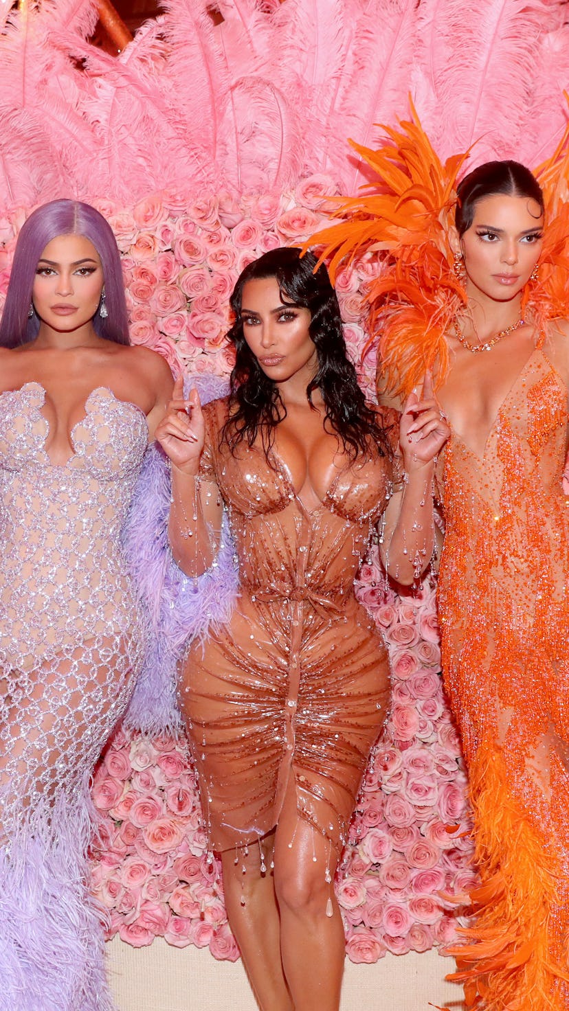 Kylie Jenner, Kim Kardashian West, and Kendall Jenner attend the 2019 Met Gala.
