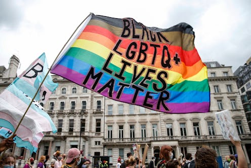  A Black LGBTQ+ Lives Matter flag flies during Black Trans Lives Matter march. The origins of pride ...