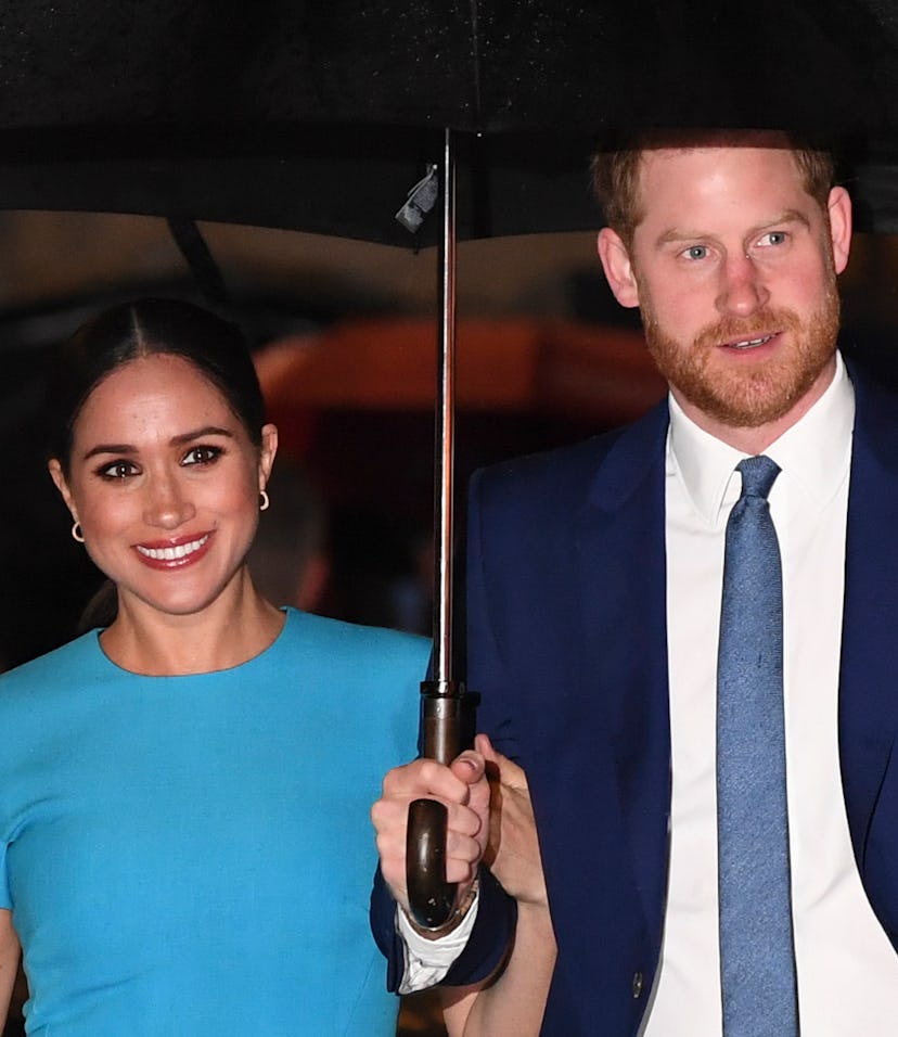 Britain's Prince Harry, Duke of Sussex (R) and Meghan, Duchess of Sussex arrive to attend the Endeav...