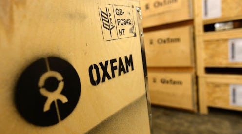 Detailed view of the Oxfam logo on a crate of Humanitarian Aid bound for Oxfam onto a waiting lorry ...