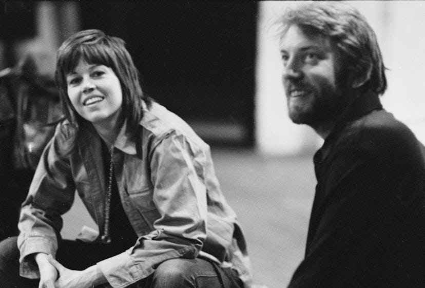 Actors Jane Fonda and Donald Sutherland sit during a performance of the anti-war road show 'F.T.A.' ...