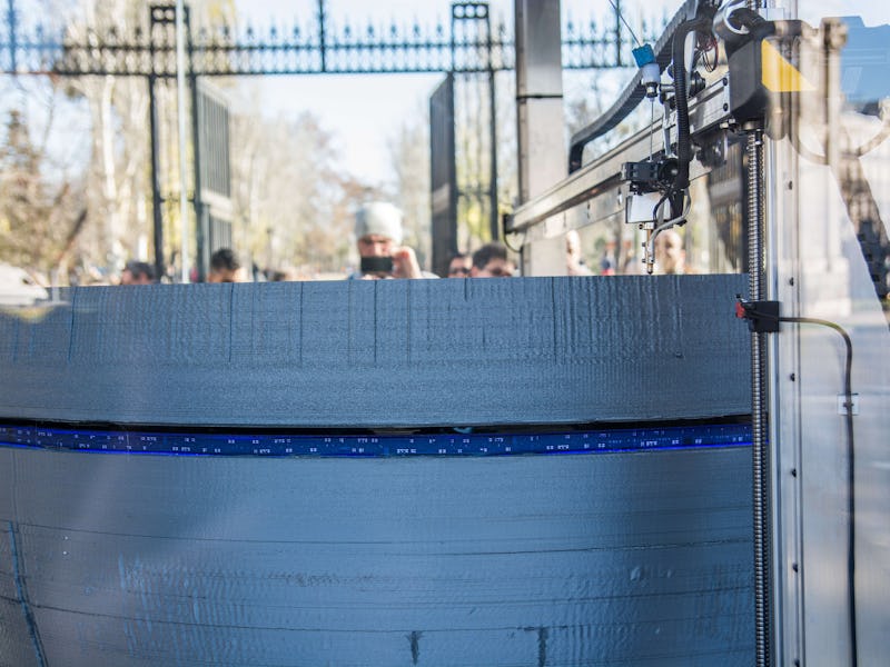 MADRID, SPAIN - 2016/12/18: A 3D large printer making a copy of Star Wars Death Star coinciding with...