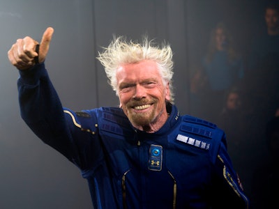 Virgin Galactic Founder Sir Richard Branson demonstrates a spacewear system, designed for Virgin Gal...