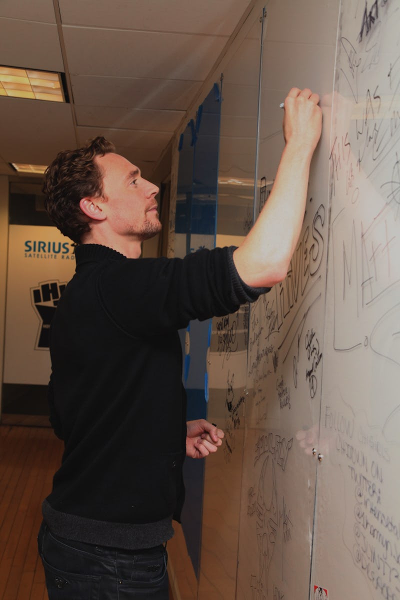 NEW YORK, NY - APRIL 30:  Actor Tom Hiddleston draws Loki on the wall at SiriusXM Studio on April 30...