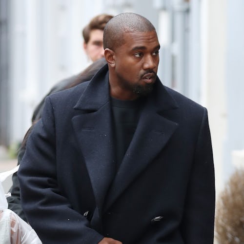 Kanye West wears a fall-appropriate coat while leaving Michiko Sushino restaurant with his daughter ...