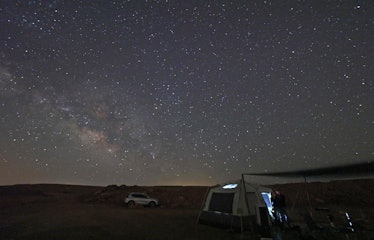 TOPSHOT - The Milky Way illuminates the sky over a campsite in Makhtesh Ramon (Ramon crater) near Is...