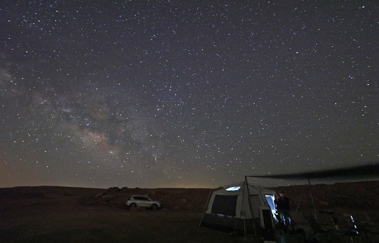 TOPSHOT - The Milky Way illuminates the sky over a campsite in Makhtesh Ramon (Ramon crater) near Is...