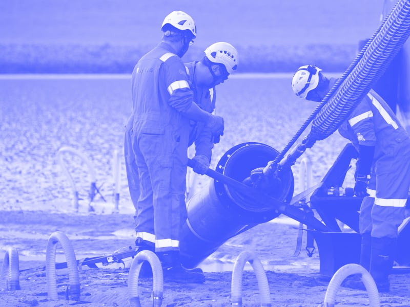 19 June 2019, Schleswig-Holstein, Büsum: The end of a 516 kilometre long submarine cable is pulled a...