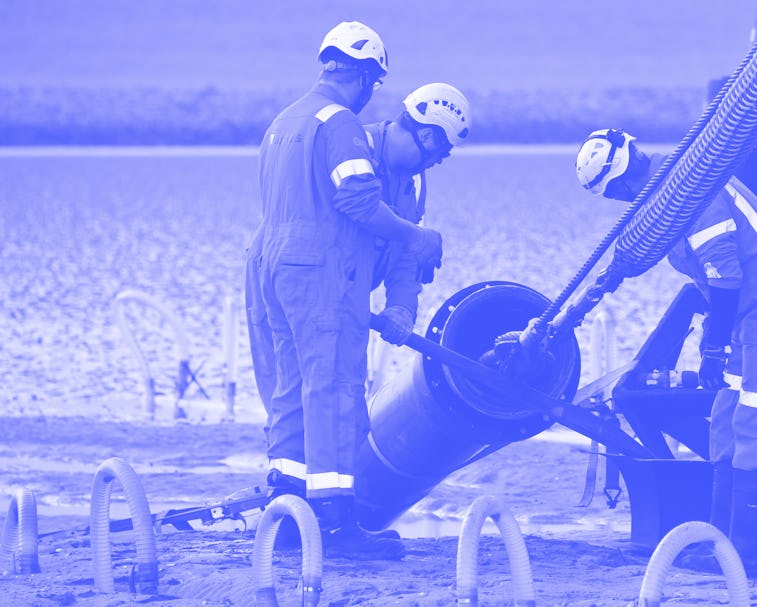 19 June 2019, Schleswig-Holstein, Büsum: The end of a 516 kilometre long submarine cable is pulled a...