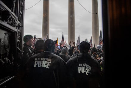 WASHINGTON, DC - JANUARY 6: Protesters fight to gain access to the U.S. Capitol during a joint congr...