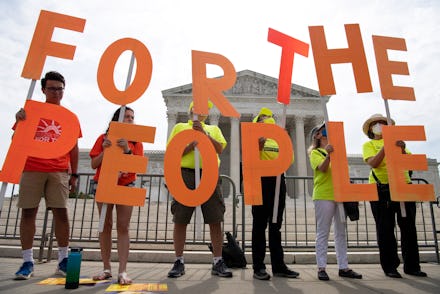 UNITED STATES - June 09: Demonstrators hold up signs as the Declaration for American Democracy coali...