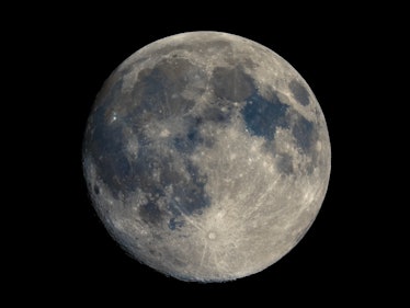 Full moon seen with an astronomical telescope, high resolution composite stacked colour image, impro...