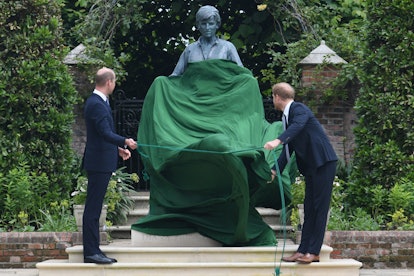 Britain's Prince William, Duke of Cambridge (L) and Britain's Prince Harry, Duke of Sussex unveil a ...