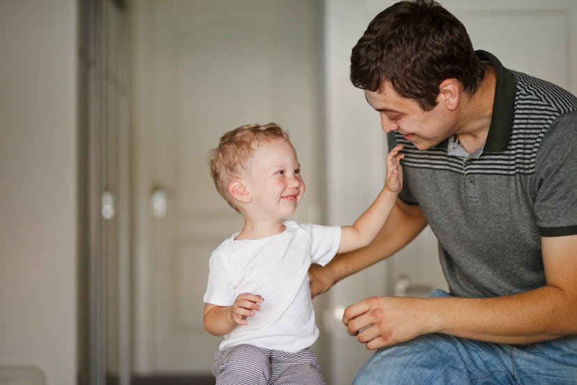 little boy and dad laughing