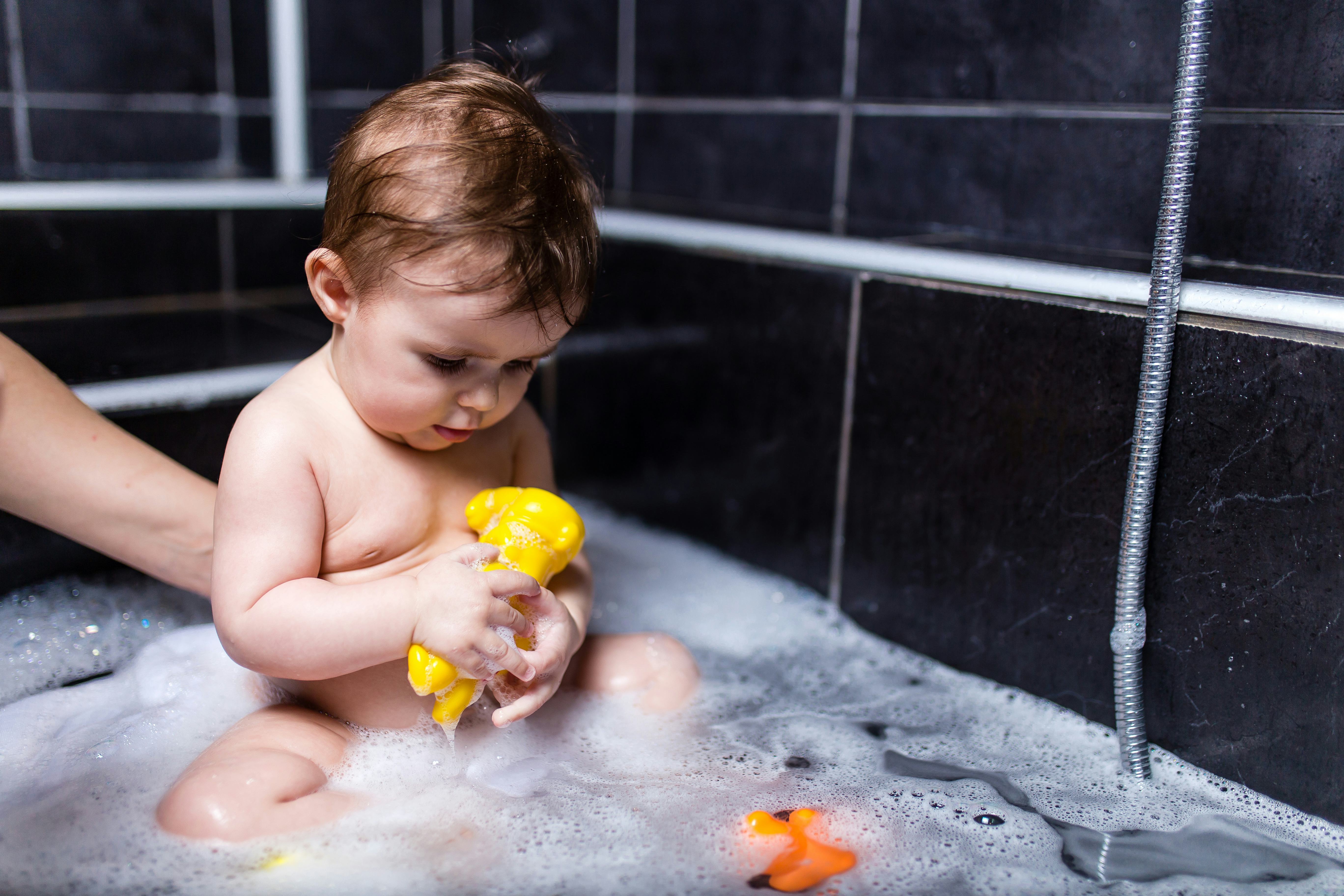 When Can Babies Sit Up In The Bath Tub? The Safe Age Range, Per Experts