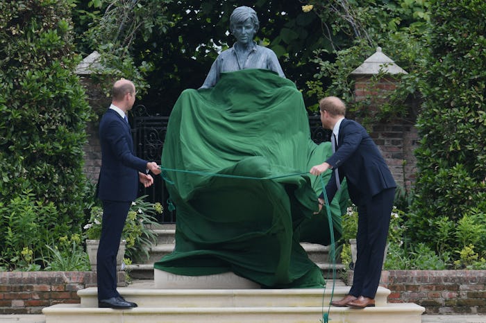 Prince William, Duke of Cambridge (L) and Prince Harry, Duke of Sussex unveil a statue of their moth...