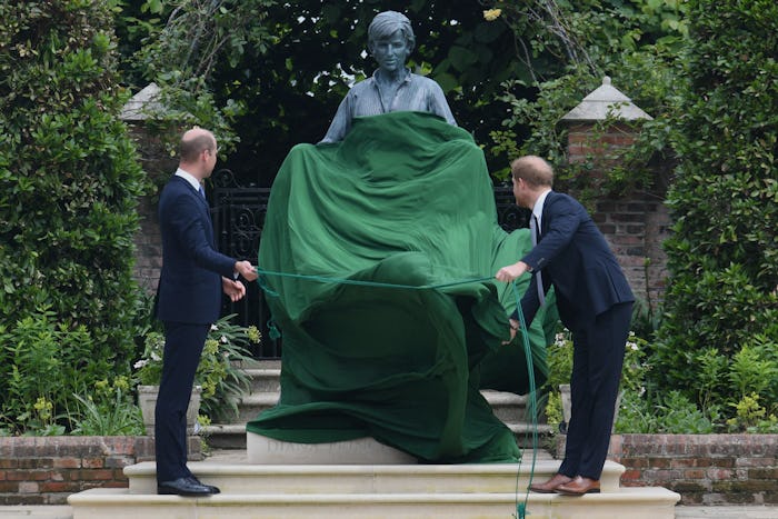 Prince William, Duke of Cambridge (L) and Prince Harry, Duke of Sussex unveil a statue of their moth...