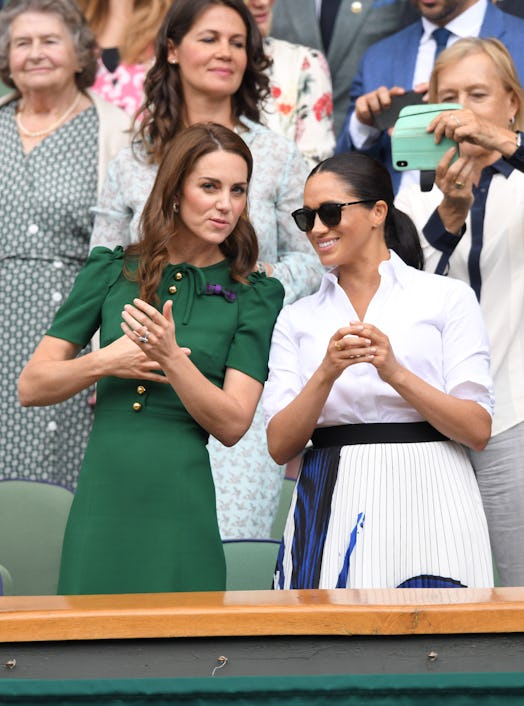 Catherine, Duchess of Cambridge and Meghan, Duchess of Sussex in the Royal Box on Centre Court durin...