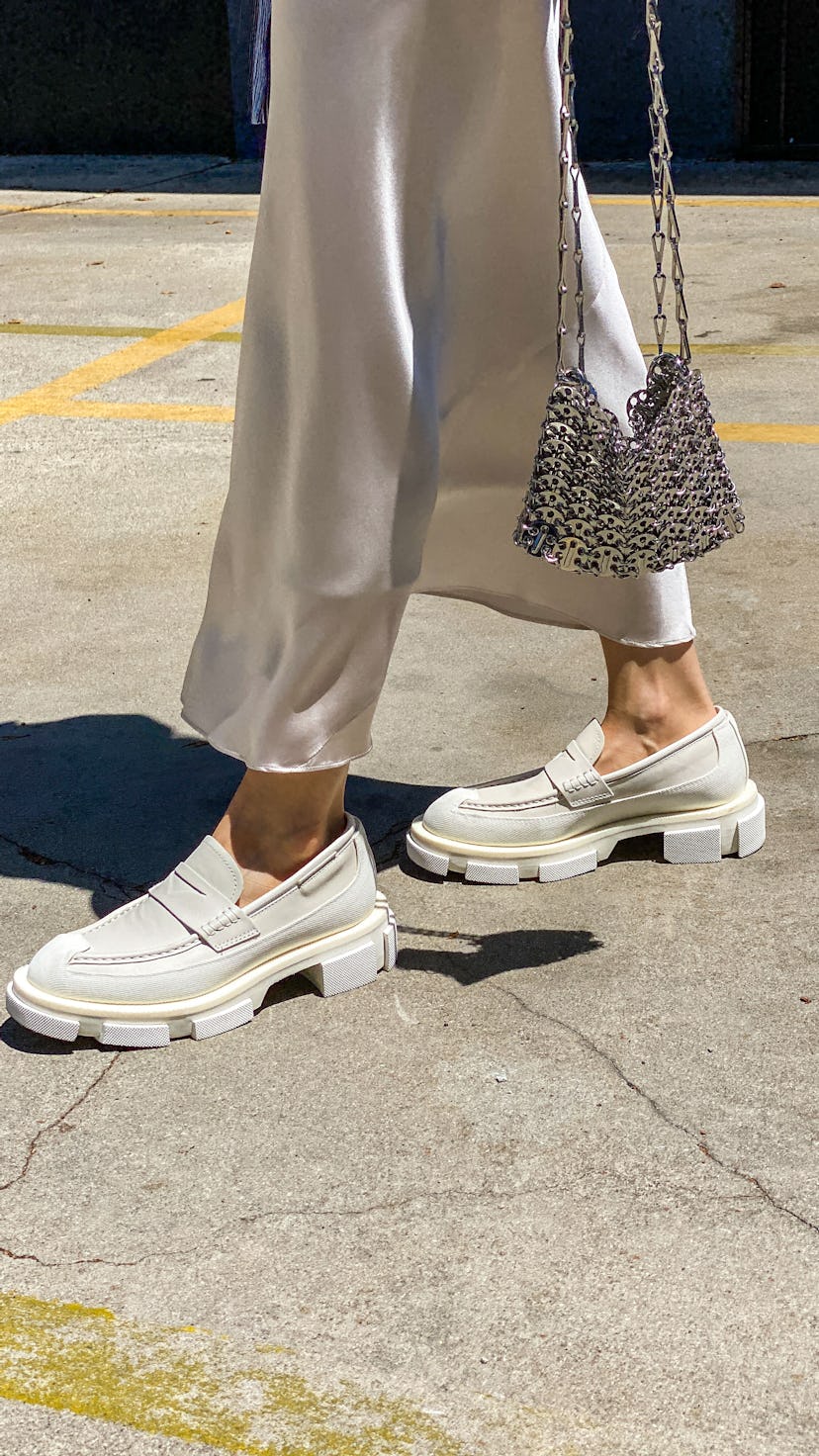 PARIS, FRANCE - JUNE 11: Julia Comil wears a silk satin skirt neutral off white by Dorothee Schumach...