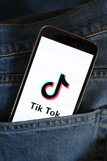 POLAND - 2021/03/22: In this photo illustration, a Tik Tok logo seen displayed on a smartphone. (Pho...