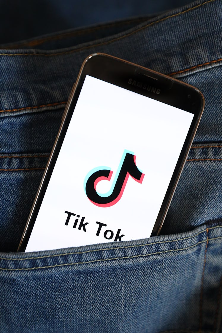 POLAND - 2021/03/22: In this photo illustration, a Tik Tok logo seen displayed on a smartphone. (Pho...