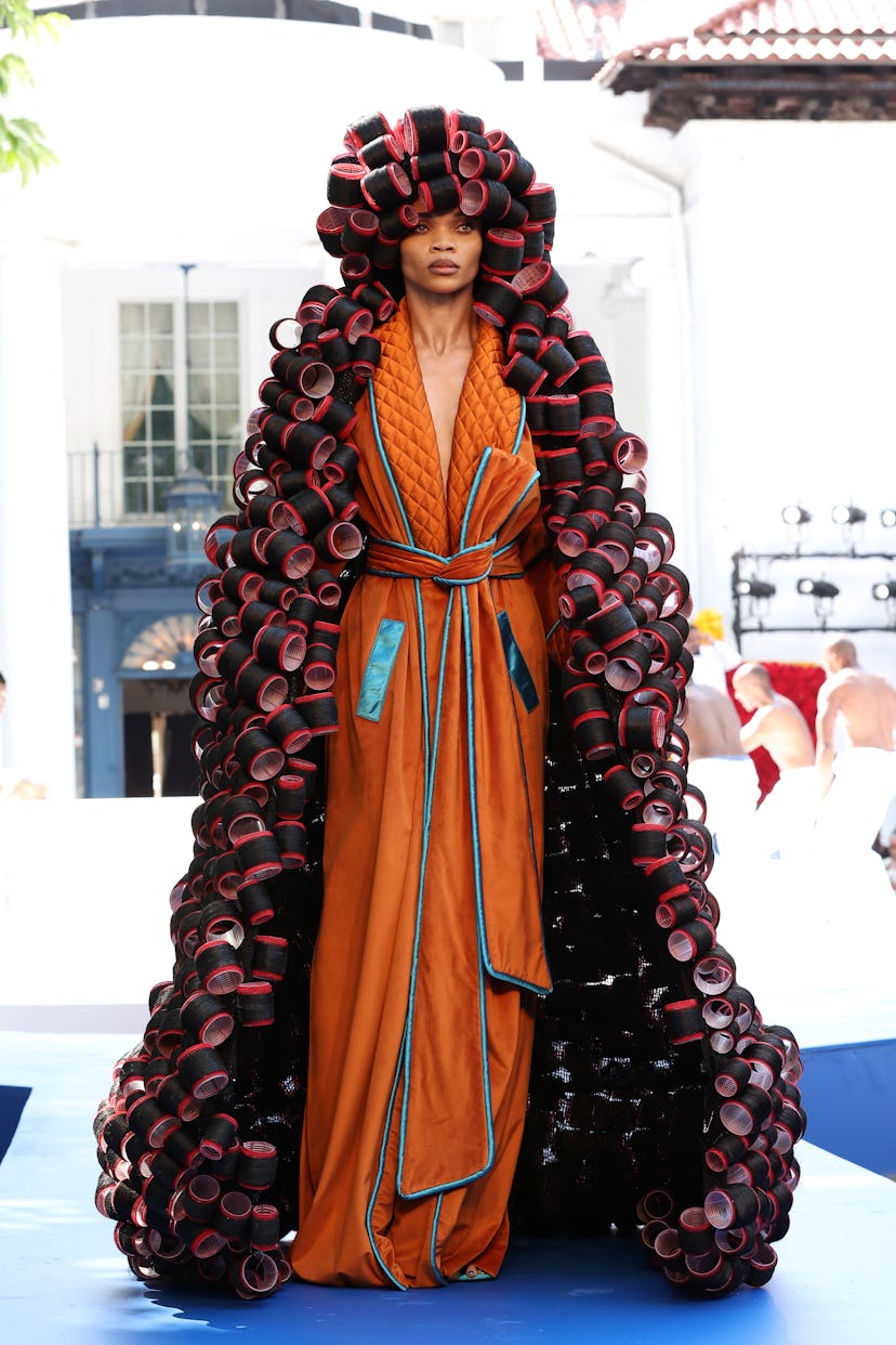 A model wearing Pyer Moss's roller coat at the Fall 2021 Couture Fashion Week
