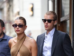 PARIS, FRANCE - JUNE 21: Hailey Bieber and Justin Bieber are seen coming out of a restaurant on June...