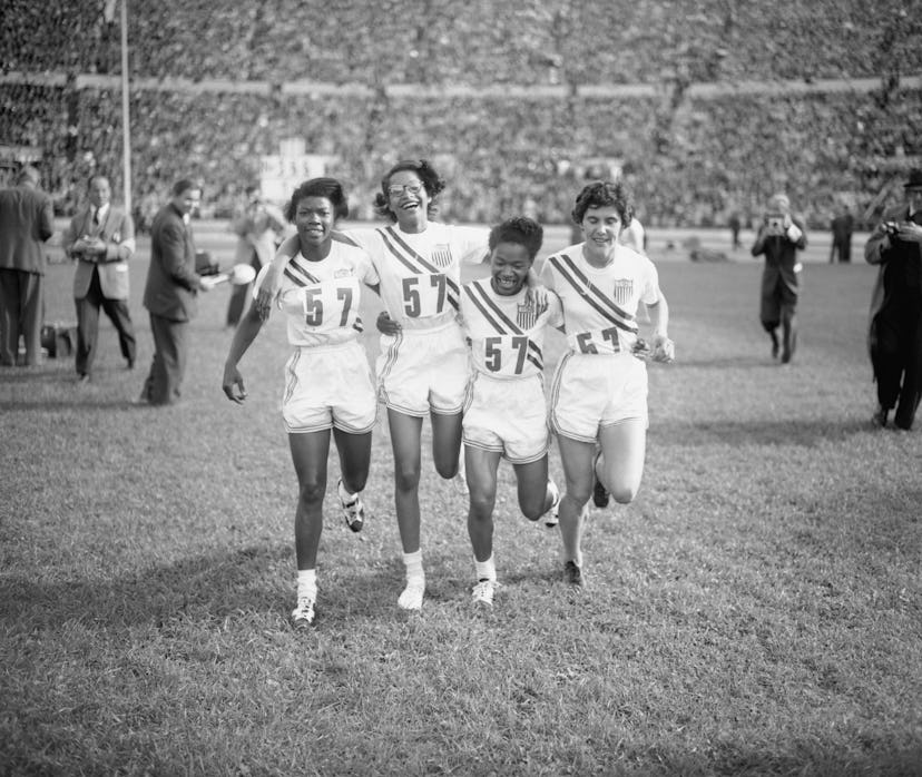 The US women's 4×100 metres relay team, winners of the event, at the Olympic Stadium during the Summ...