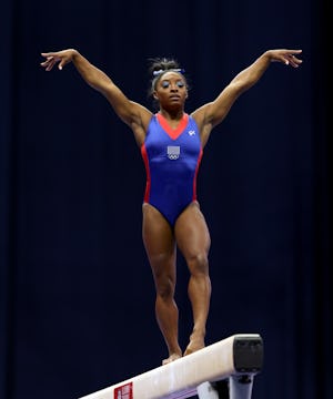 ST LOUIS, MISSOURI - JUNE 25:  Simone Biles warms up on the balance beam prior to the Women's compet...