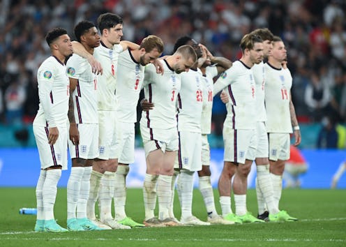 LONDON, ENGLAND - JULY 11: Jadon Sancho of England reacts with teammates after his penalty miss duri...