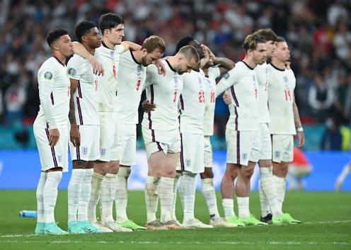 LONDON, ENGLAND - JULY 11: Jadon Sancho of England reacts with teammates after his penalty miss duri...