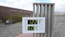 The temperature gauge at the Furnace Creek Visitors Center in Death Valley displays 125 degrees afte...