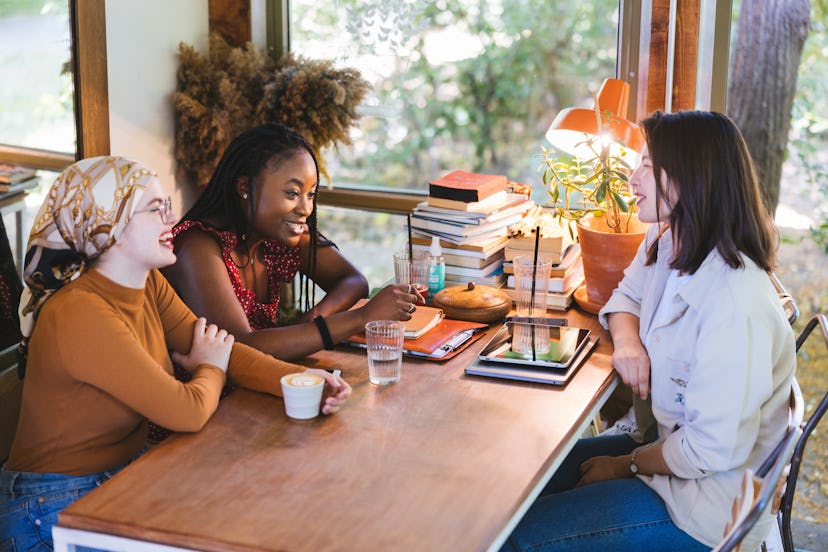 Group of friends having cheerful conversation