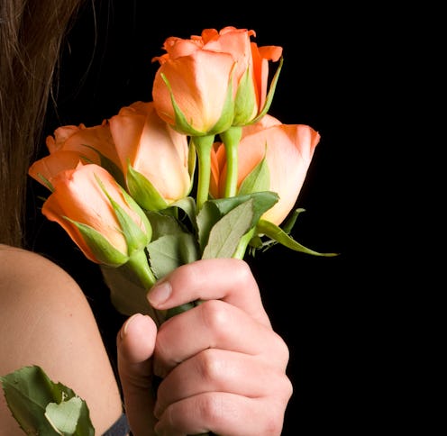 Young Woman Holding Red Roses