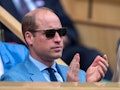 Britain's Prince William, Duke of Cambridge, applauds as he sits in the Royal box to watch the women...