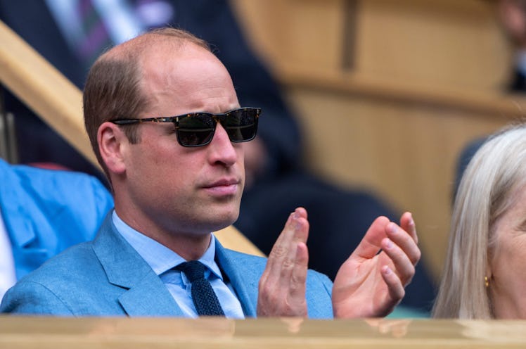 Britain's Prince William, Duke of Cambridge, applauds as he sits in the Royal box to watch the women...