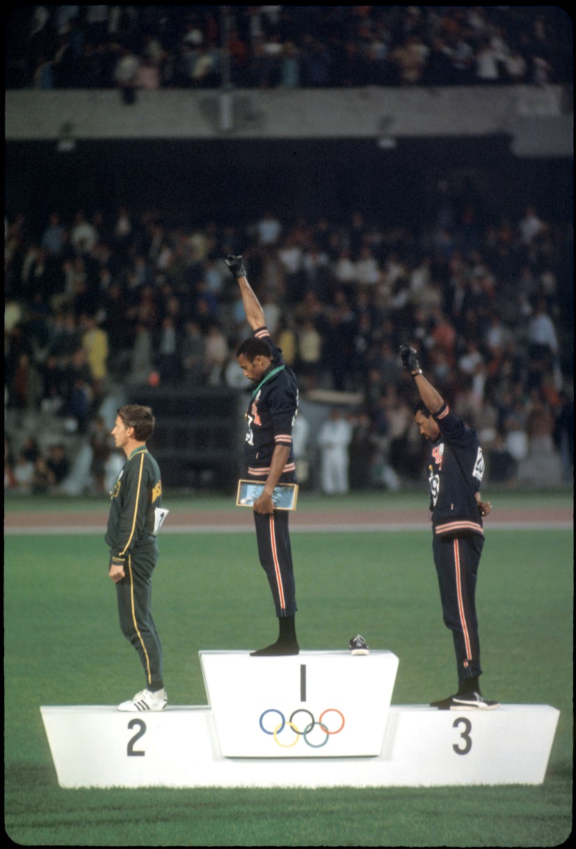 12-27 OCT 1968:  Tommy Smith (307) (1st place) and John Carlos (259) (3rd place) of the US raise the...