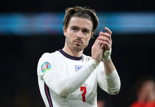 England's Jack Grealish applauds the fans following defeat in the penalty shoot-out after the UEFA E...