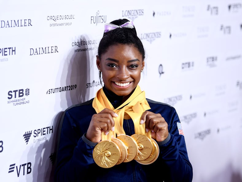 STUTTGART, GERMANY - OCTOBER 13: Simone Biles of The United States poses for photos with her multipl...