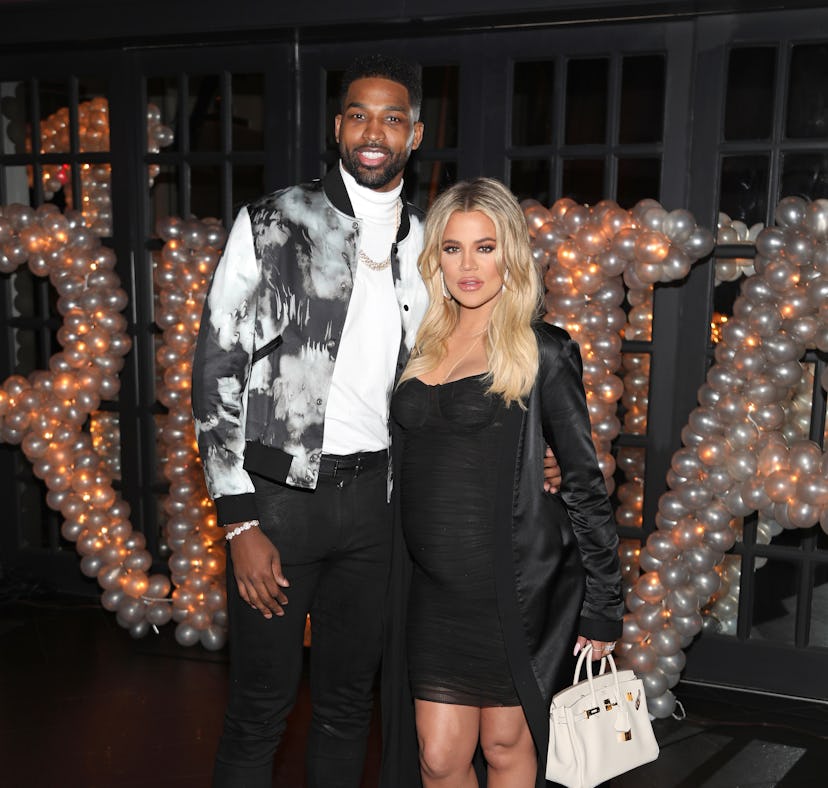 Tristan Thompson and Khloe Kardashian pose for a photo.