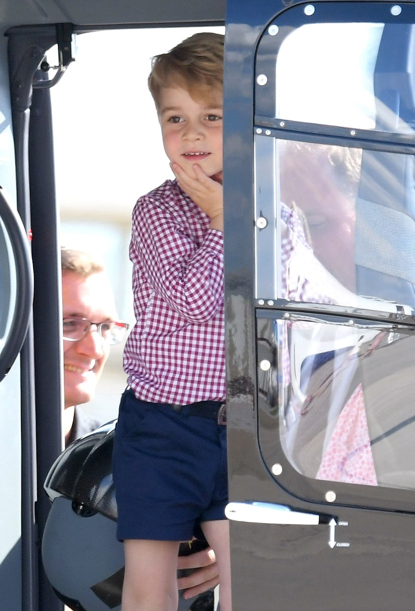 Prince George gets a kick out of a helicopter.