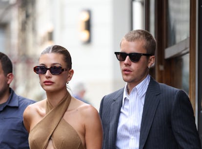 PARIS, FRANCE - JUNE 21: Hailey Bieber and Justin Bieber are seen coming out of a restaurant on June...