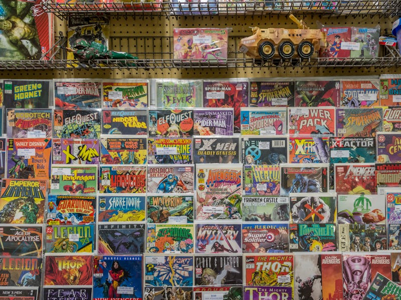 Rack of comic books and toys for sale at a flea market. (Photo by: Education Images/Universal Images...