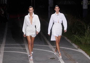 PARIS, FRANCE - SEPTEMBER 27:  Bella Hadid and Kendall Jenner walk the runway during the Off-White s...