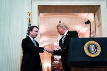 WASHINGTON, DC - OCTOBER 8 : Associate Justice Brett Kavanaugh greets President Donald J. Trump duri...